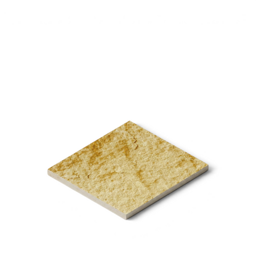 Canteras Naturales Santo Tomás Cantera Oro natural stone tile with a textured golden ochre surface for wall cladding.