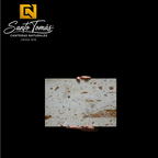 Canteras Naturales Santo Tomás Cantera Piñón stone slab with cream base and reddish-brown speckled texture
