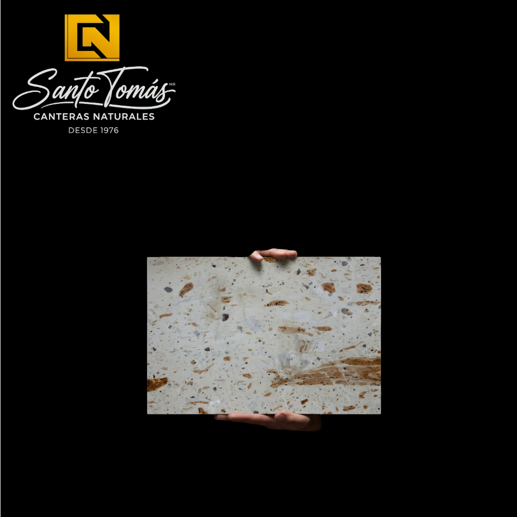 Canteras Naturales Santo Tomás Cantera Piñón stone slab with cream base and reddish-brown speckled texture