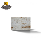 Canteras Naturales Santo Tomás Cantera Piñón stone tile with cream base and reddish-brown speckled texture.