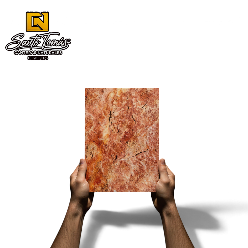Hands holding a Canteras Naturales Santo Tomás red Tlayua natural stone tile with rustic texture and gold veins.