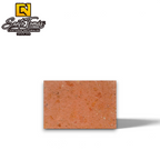 Canteras Naturales Santo Tomás Cantera Roja Tagui stone tile with a warm terracotta finish and fine dark speckles.