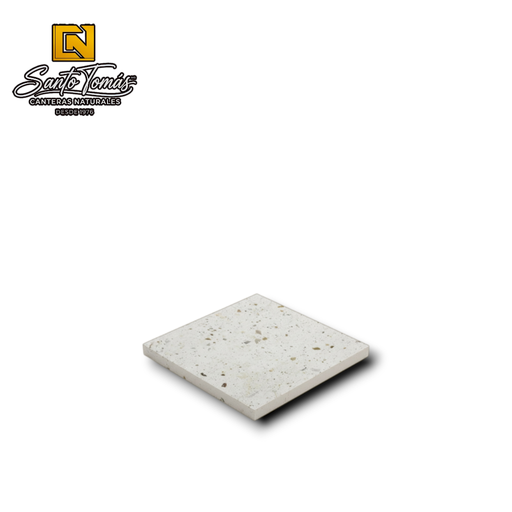 Canteras Naturales Santo Tomás white Mexican stone tile with natural green, grey, and black mineral inclusions.